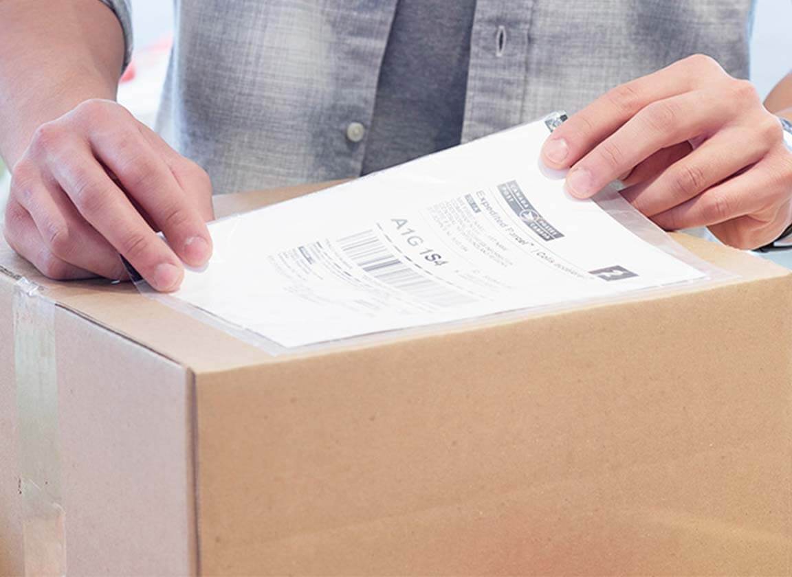 A securely packaged box with shipping labels for different countries.